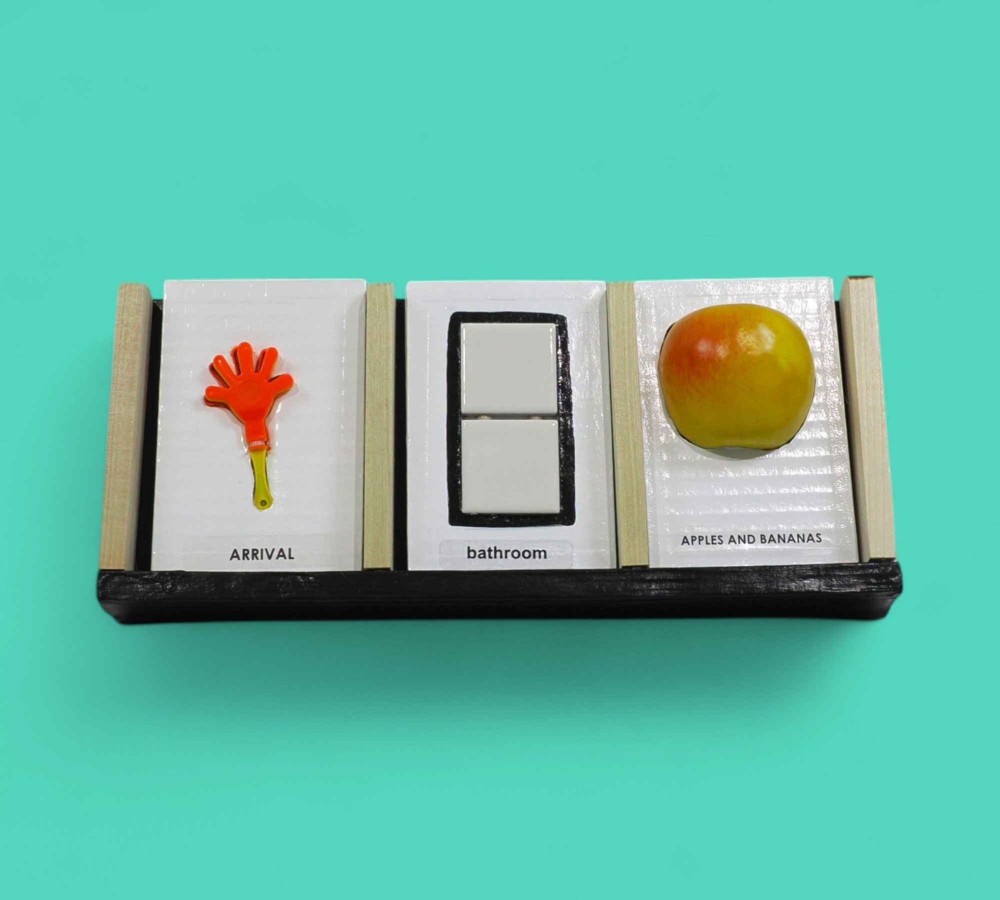 The Calendar tactile accesory each slot holds a tangible or symbol card holder with a built-in back compartment offers convenient storage for extra cards or can be used as a “finished” section, allowing users to move completed activities out of view and reinforce a sense of progress and routine. Thoughtfully designed for use at home, in classrooms, or in therapy settings, this display helps make time, tasks, and transitions more concrete and accessible. 