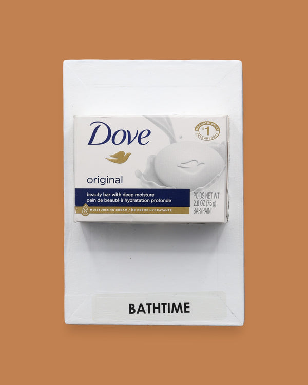 The Bath Time symbol with a mini soap box embedded in the center. Labeled "Bath Time" in black font at the bottom of symbol on white backing.