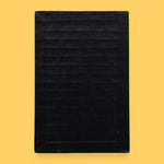 The Blank symbol card has no symbol embedded. Labeled "Blank" in white font at the bottom of symbol on clear backing. The background of the symbol is black.