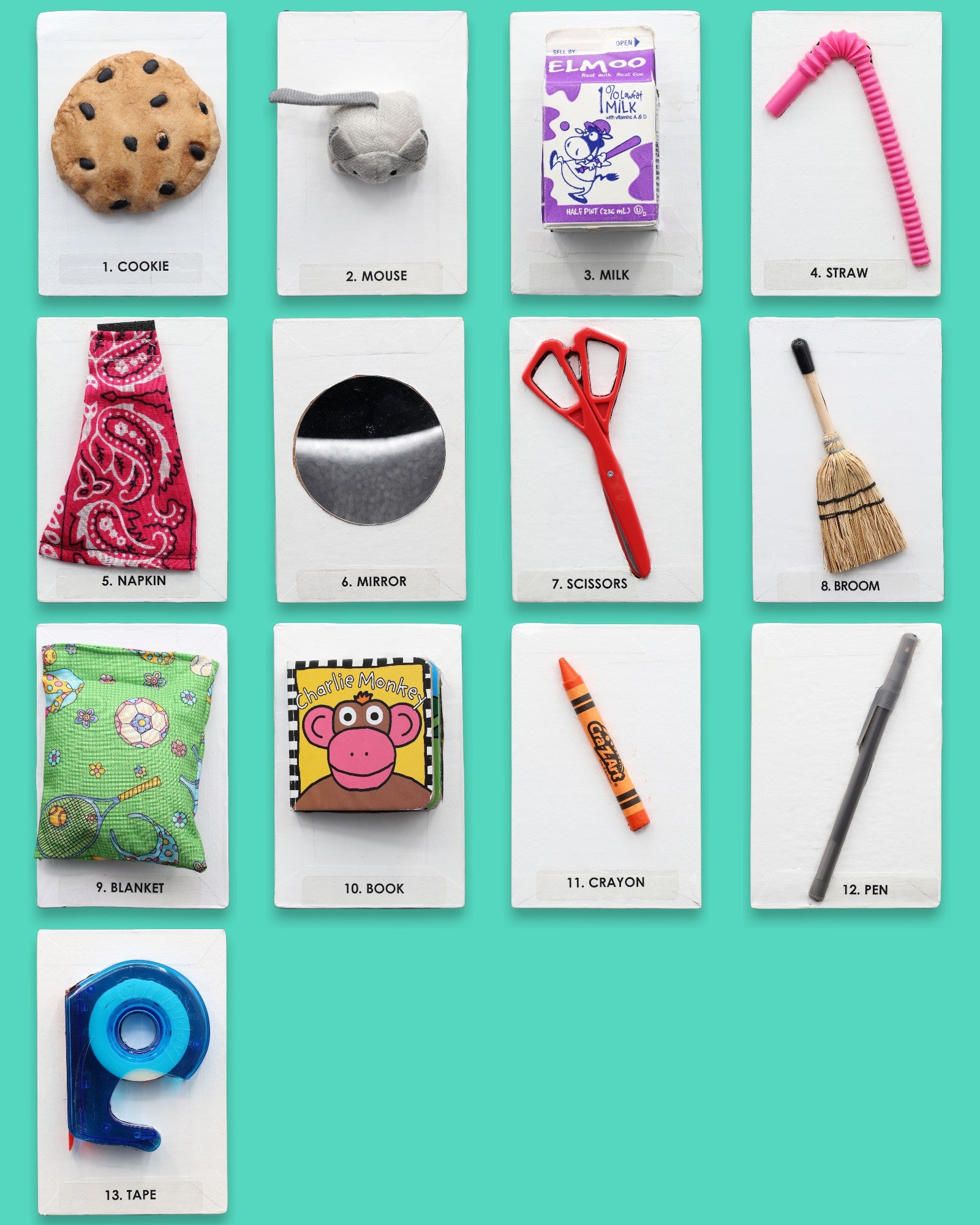 The Give A Mouse A Cookie Storybook tactile symbol set has an assortment of 12 tactile symbols that includes a mini board book titled "Give A Mouse A Cookie" and 11 symbols of Cookie, Crayon, Milk, Broom, Blanket, Straw, Mirror, Mouse, Tape. The background of the symbols is white.