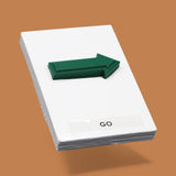 This image displays a standard white tactile card that is 4 by 6 inches in size.  The tactile card holds a layered green 3D arrow pointing to the right. The tactile card is labeled Go below the arrow.