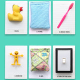 The Going To Bed Storybook tactile symbol set has an assortment of 7 tactile symbols that includes a mini board book titled "Going To Bed" and 6 symbols of Bed, Bath, Brush Teeth, Exercise, Towel, and Turn Off Light. The background of the symbols is white.
