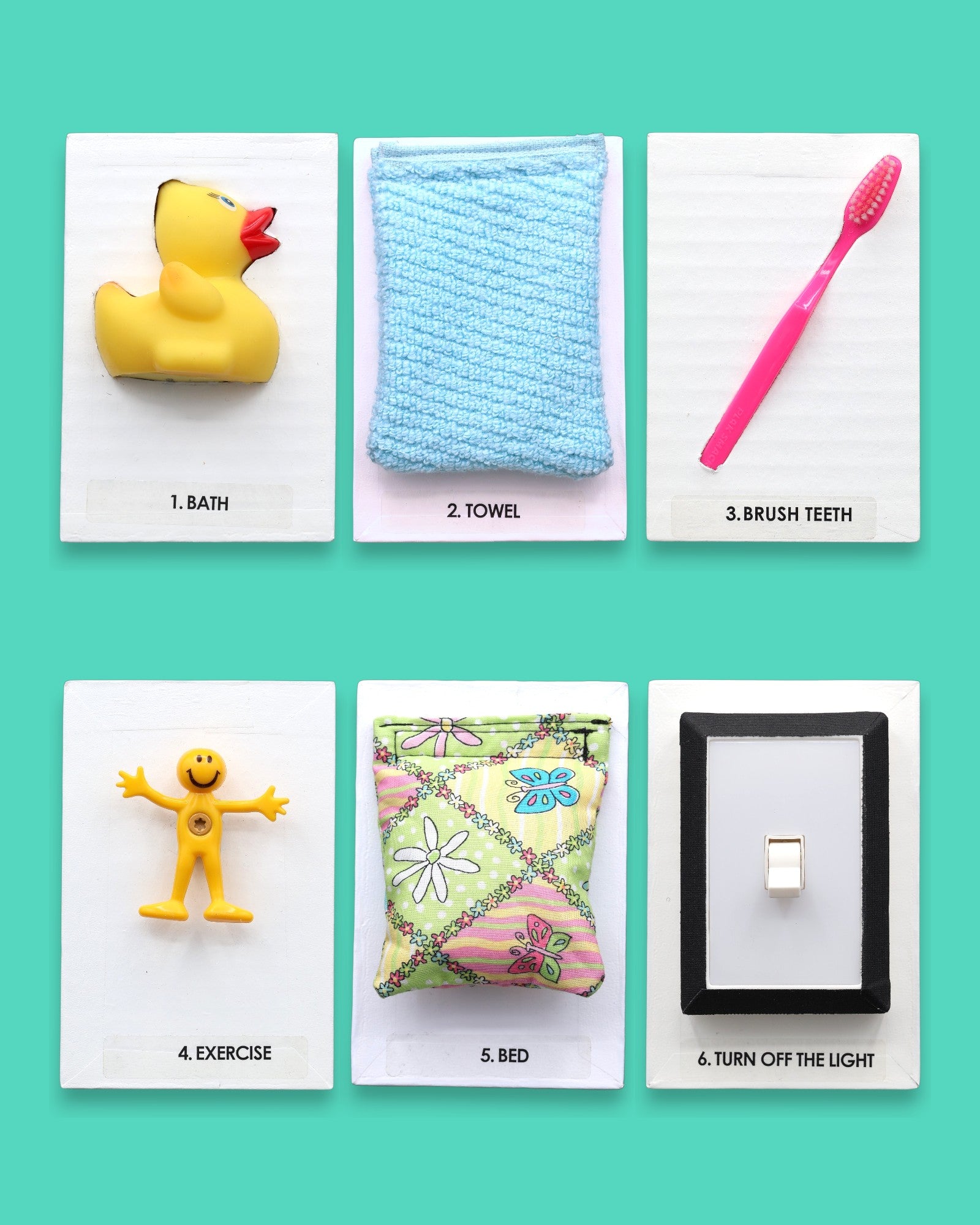 The Going To Bed Storybook tactile symbol set has an assortment of 7 tactile symbols that includes a mini board book titled "Going To Bed" and 6 symbols of Bed, Bath, Brush Teeth, Exercise, Towel, and Turn Off Light. The background of the symbols is white.