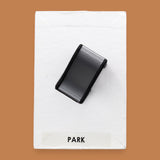 The Park Slide symbol with a small toy shaped slide embedded in the center. Labeled "Park" in black font on white backing at teh bottom of the symbol. The background of the symbol is white. 
