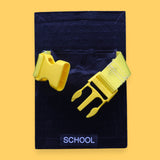 The School high contrast tactile symbol with a bright yellow open buckle strap. Labeled "School" in white font at the bottom of symbol on clear backing. The background of the symbol is black. 