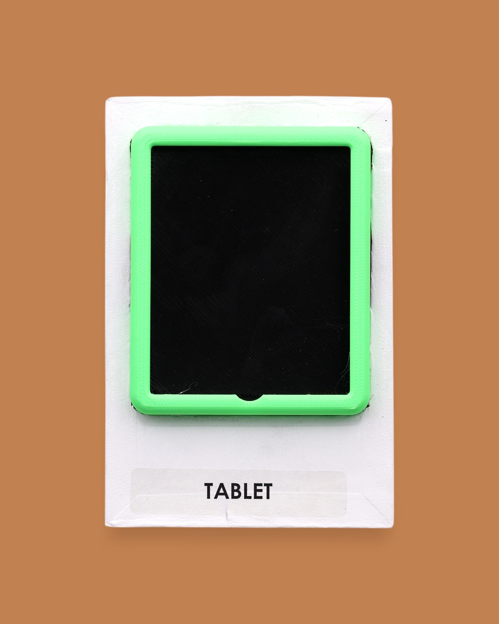 The Tablet symbol 3D printed-filament in lime green with a black like screen embedded in the center. Labeled "Tablet" in black font on white backing at the bottom of the symbol. The background of the symbol is white. 