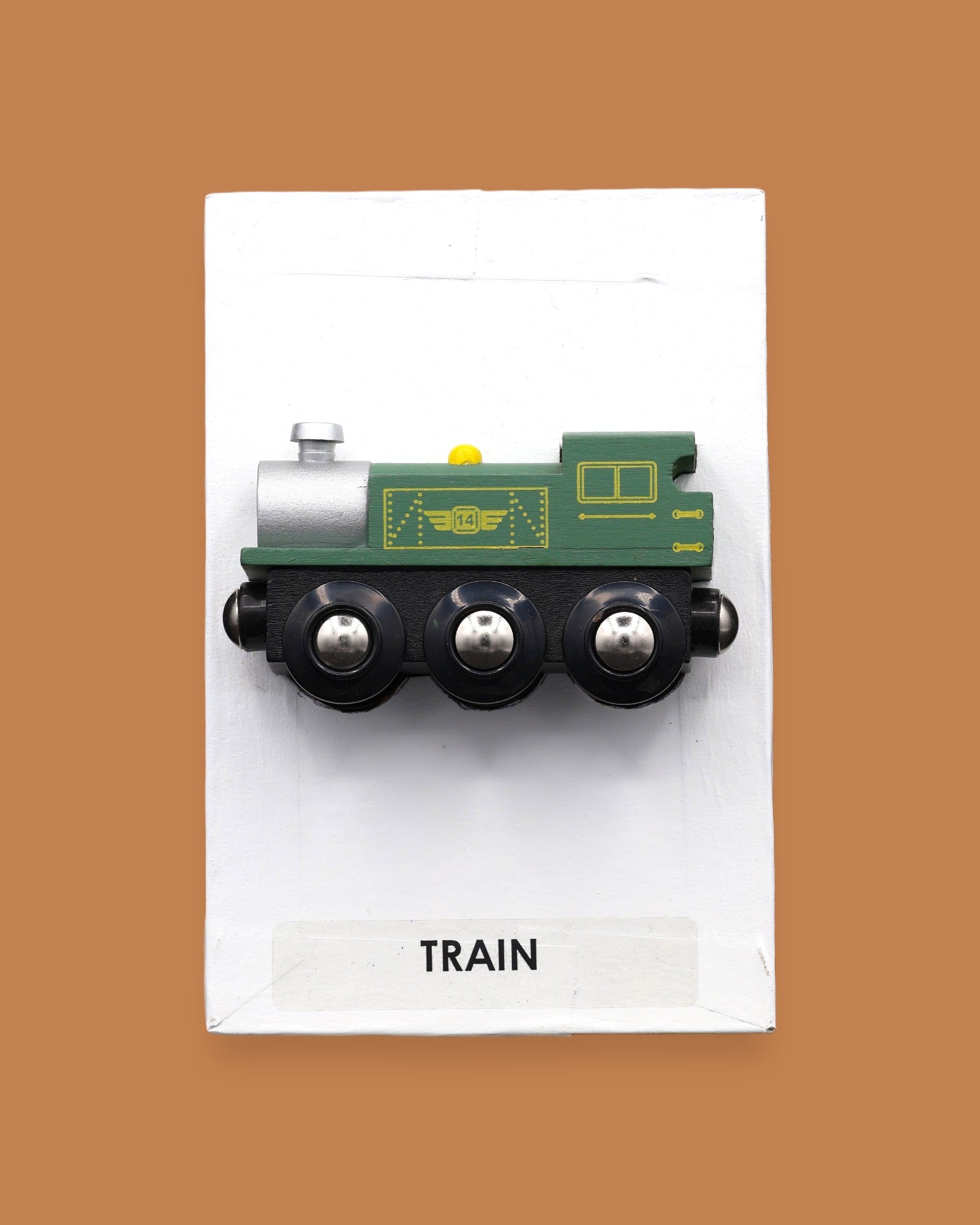 The Train symbol with a green toy-like small train embedded horizontally. Labeled "Train" in black font on white backing at the bottom of the symbol. The background of the symbol is white. 