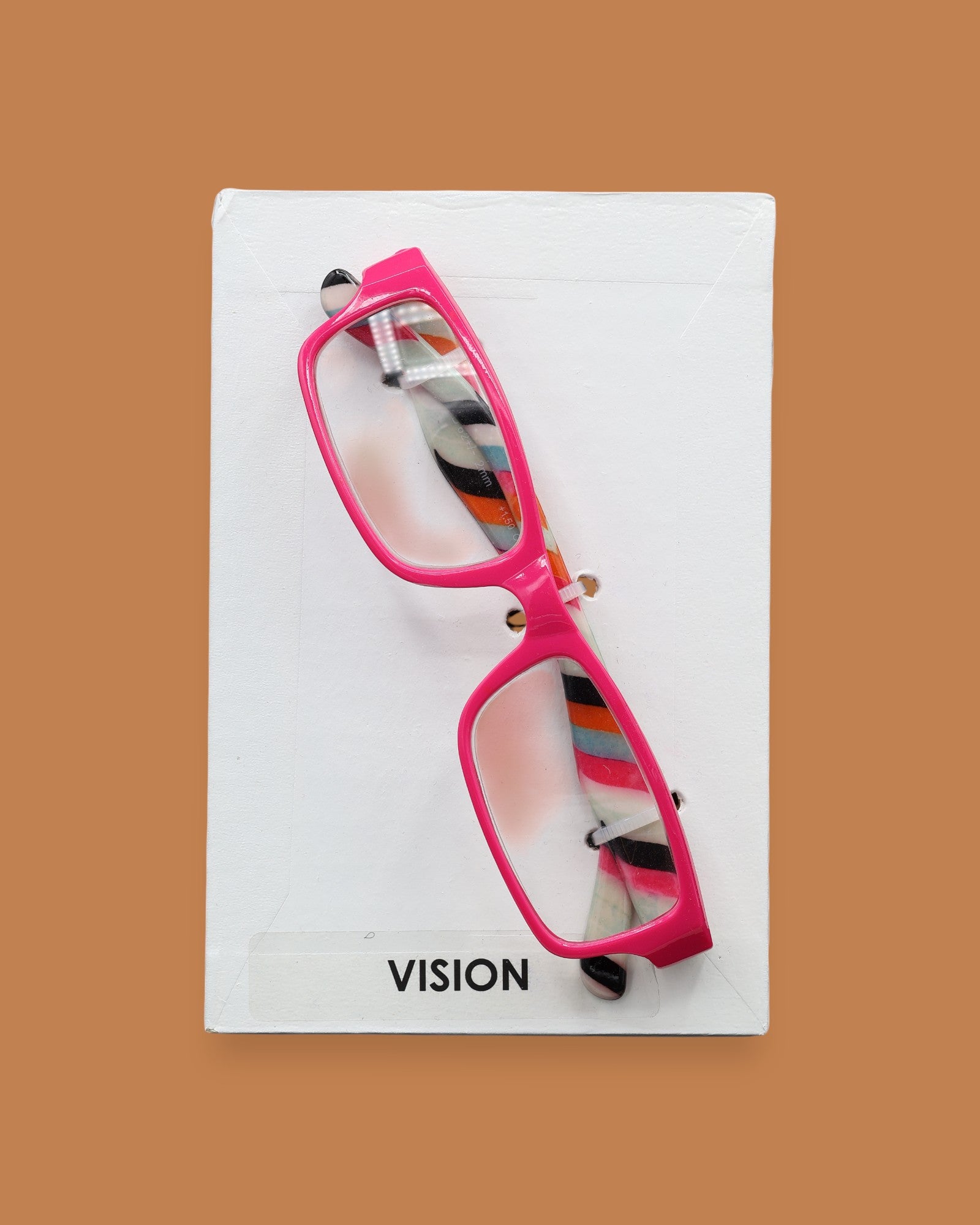 The Vision symbol has plastic eye-glasses of varied colors embedded in the center. Labeled "Vision" in black font and white backing. The background of the symbol is white. 