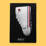 The Walk symbol features a toddler size sneaker embedded in the center. Labeled "Walk" in black font on white backing. The background of the symbol is white. 