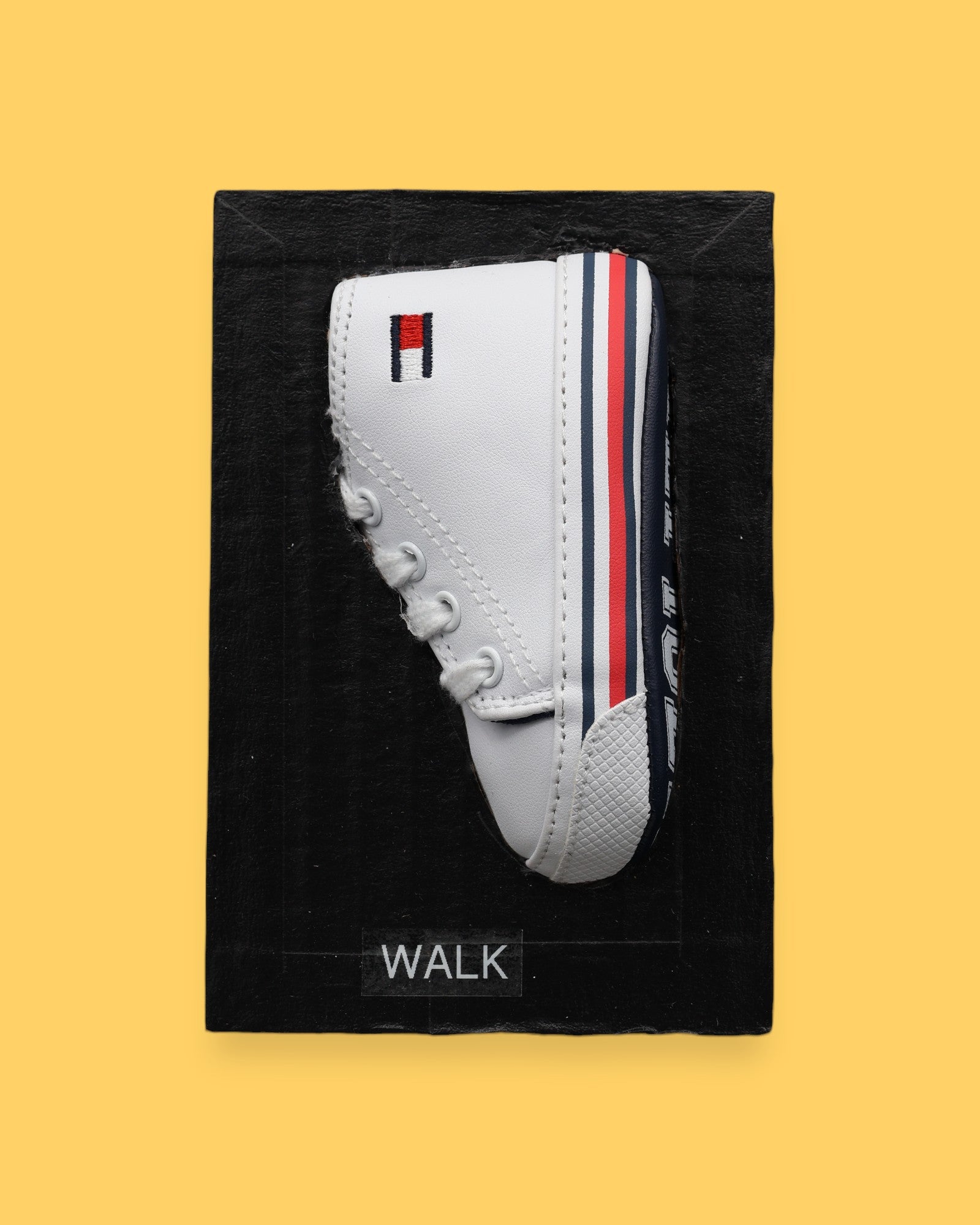 The Walk symbol features a toddler size sneaker embedded in the center. Labeled "Walk" in black font on white backing. The background of the symbol is white. 